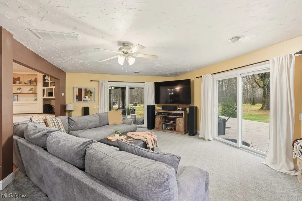 Family Room with Fireplace and Leads to a Wrap Around Deck