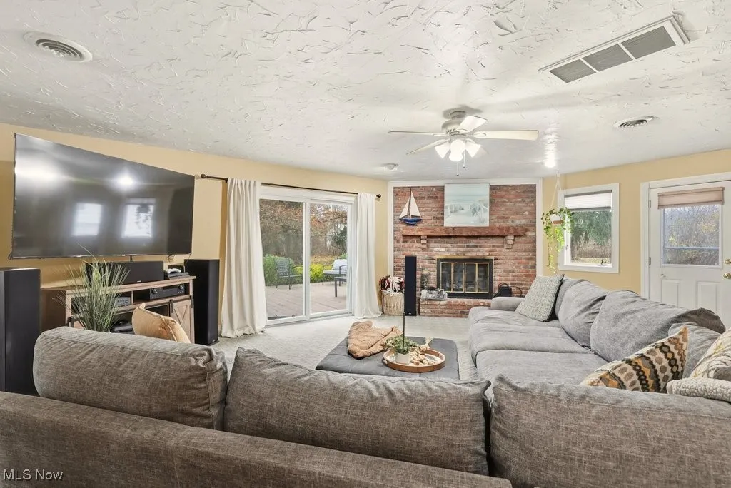 Family Room with Fireplace and Leads to a Wrap Around Deck