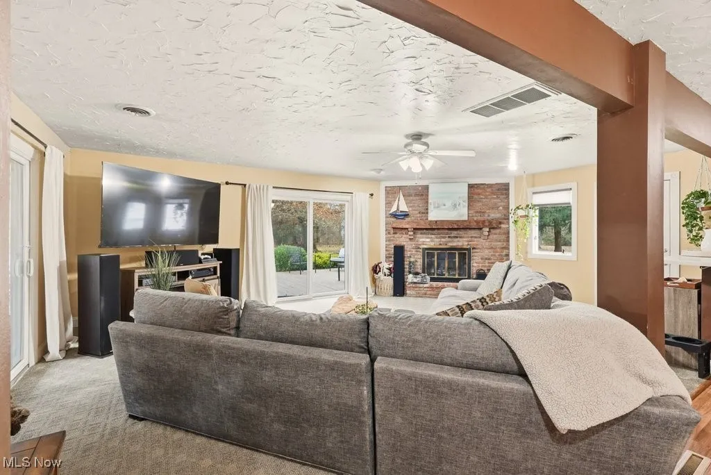 Family Room with Fireplace and Leads to a Wrap Around Deck