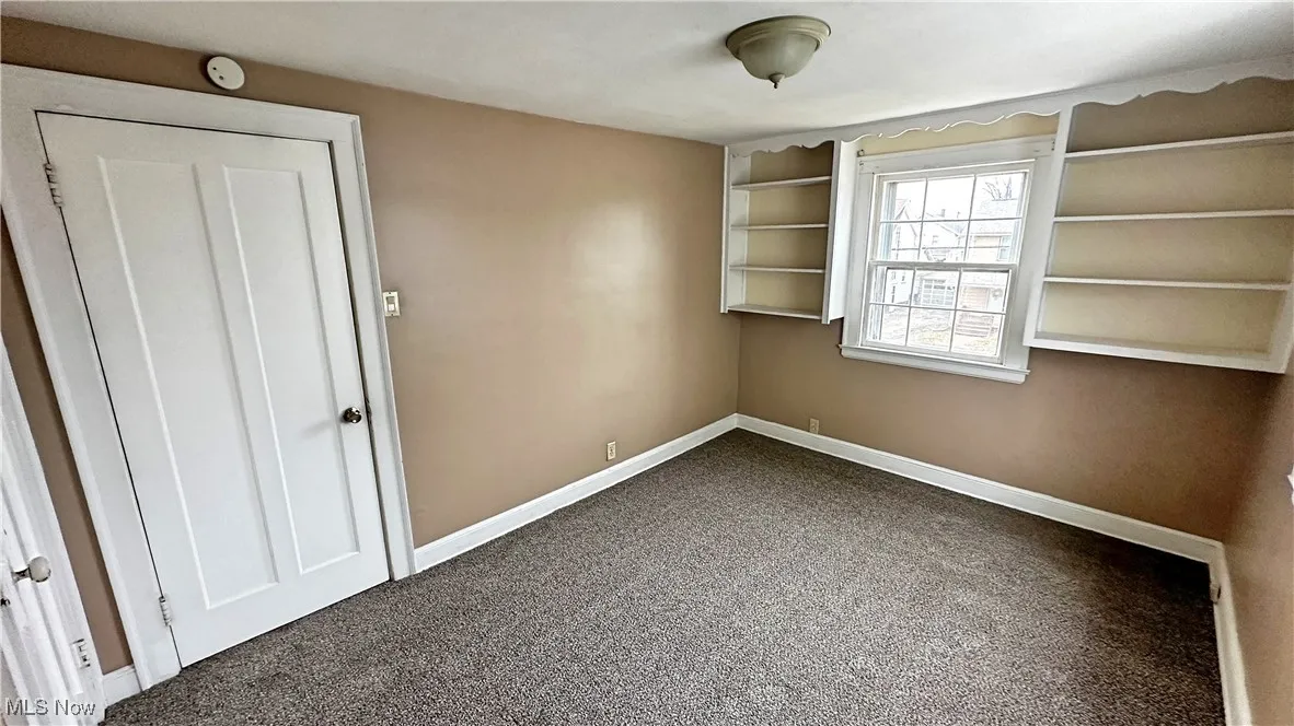 Great size bedroom with built in book shelves.