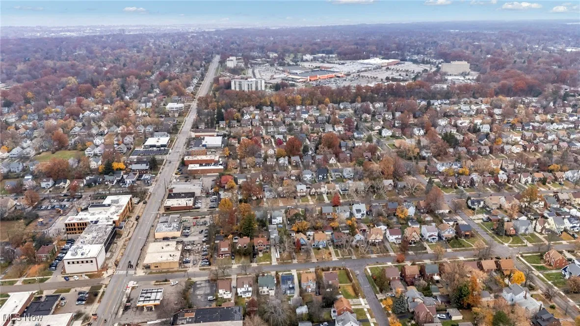 Aerial view of property's location featuring nearby suburban area