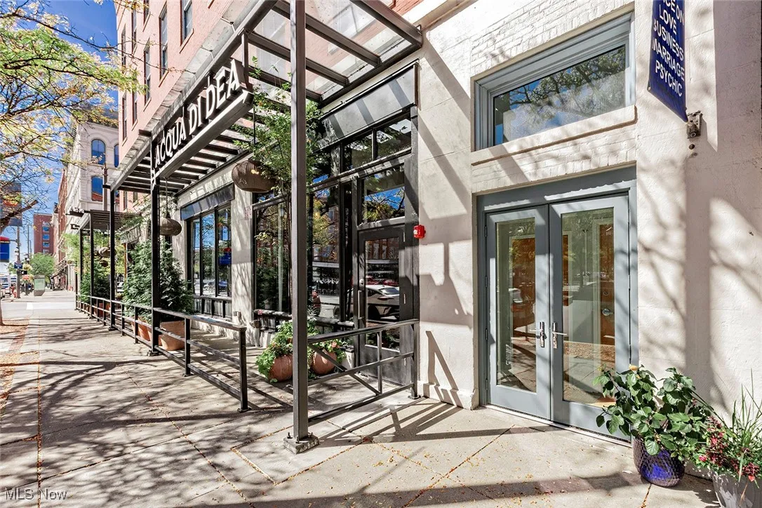 Doorway to property featuring french doors and stucco siding