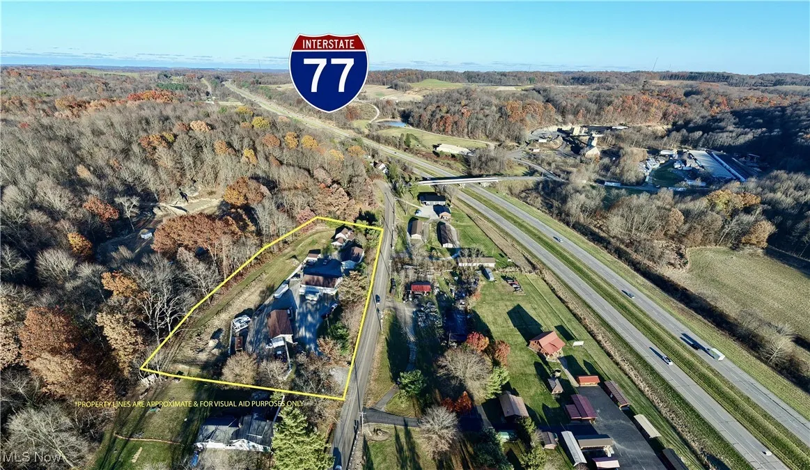 Aerial overview of property's location with a forest and property parcel outlined