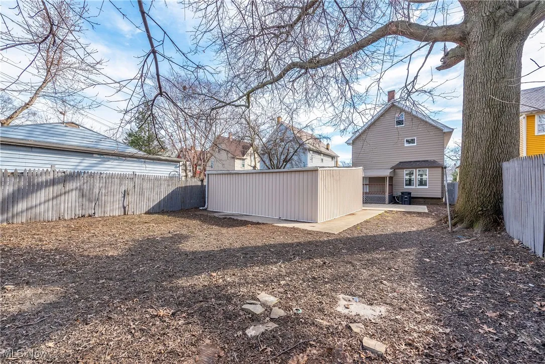 Fenced backyard with a patio area