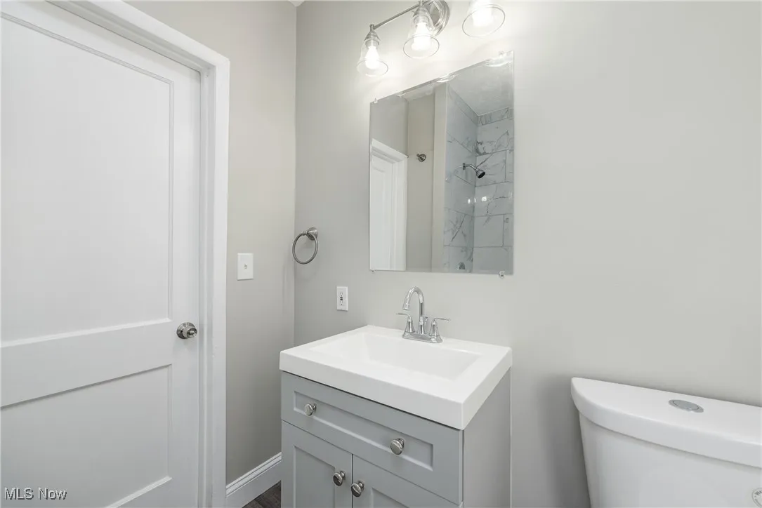 Full bath with vanity and a tile shower