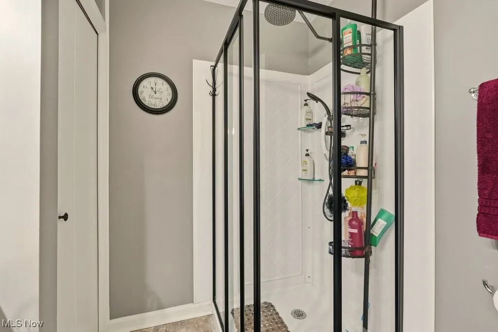 Full bathroom with a stall shower