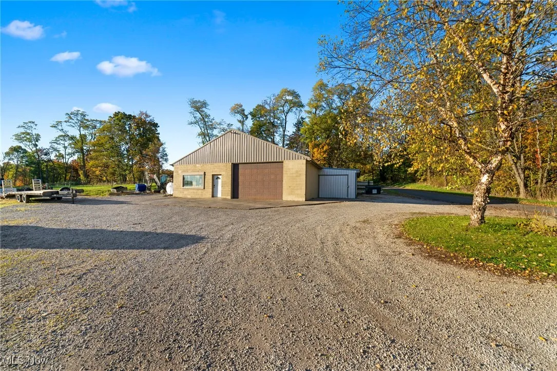 Garage featuring driveway