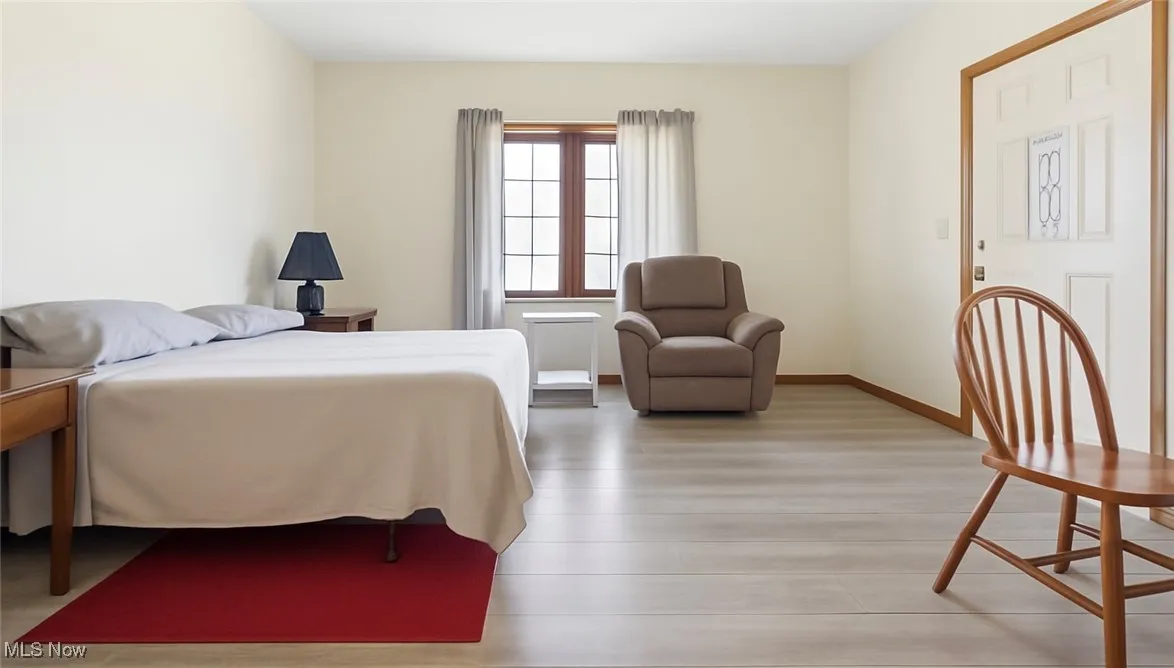 Living Room temporality Converted to Bedroom space. *This is a Virtually Staged Photo for reference to space*