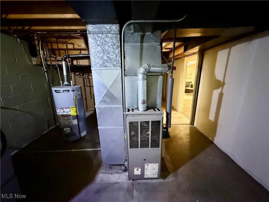 Utilities featuring gas water heater and heating unit