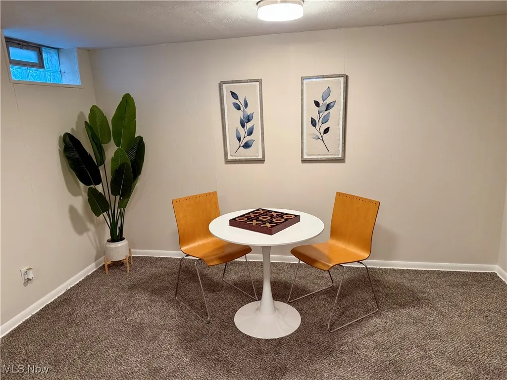 Living area featuring carpet flooring