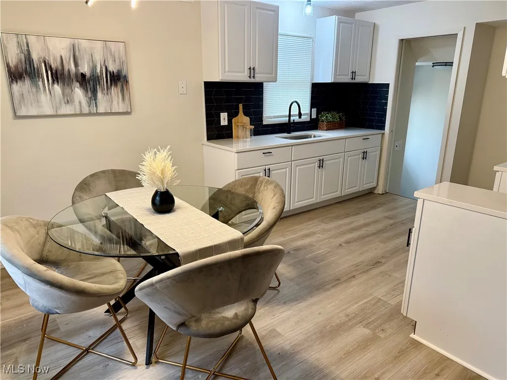 Dining space featuring light wood-type flooring