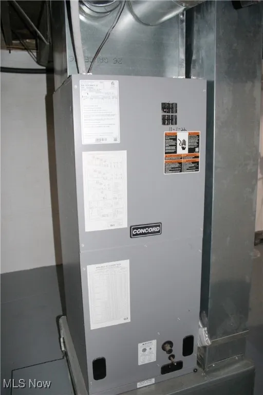 Utility room featuring heating unit