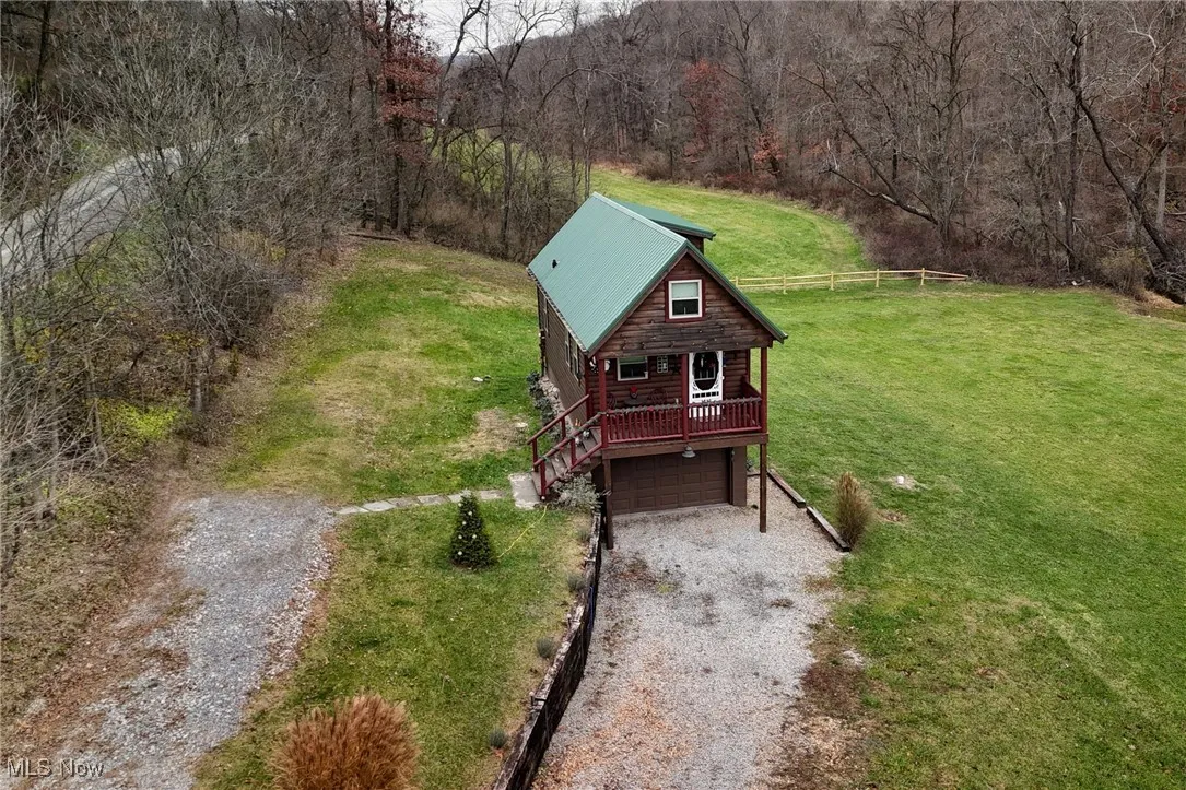 View from above of property with a forest