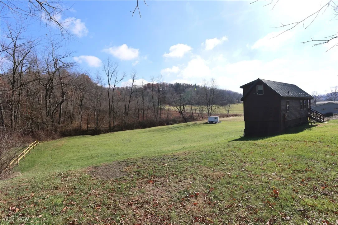View of green lawn with an outdoor structure