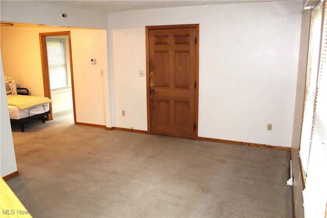 Living room looking into dining room and sun room