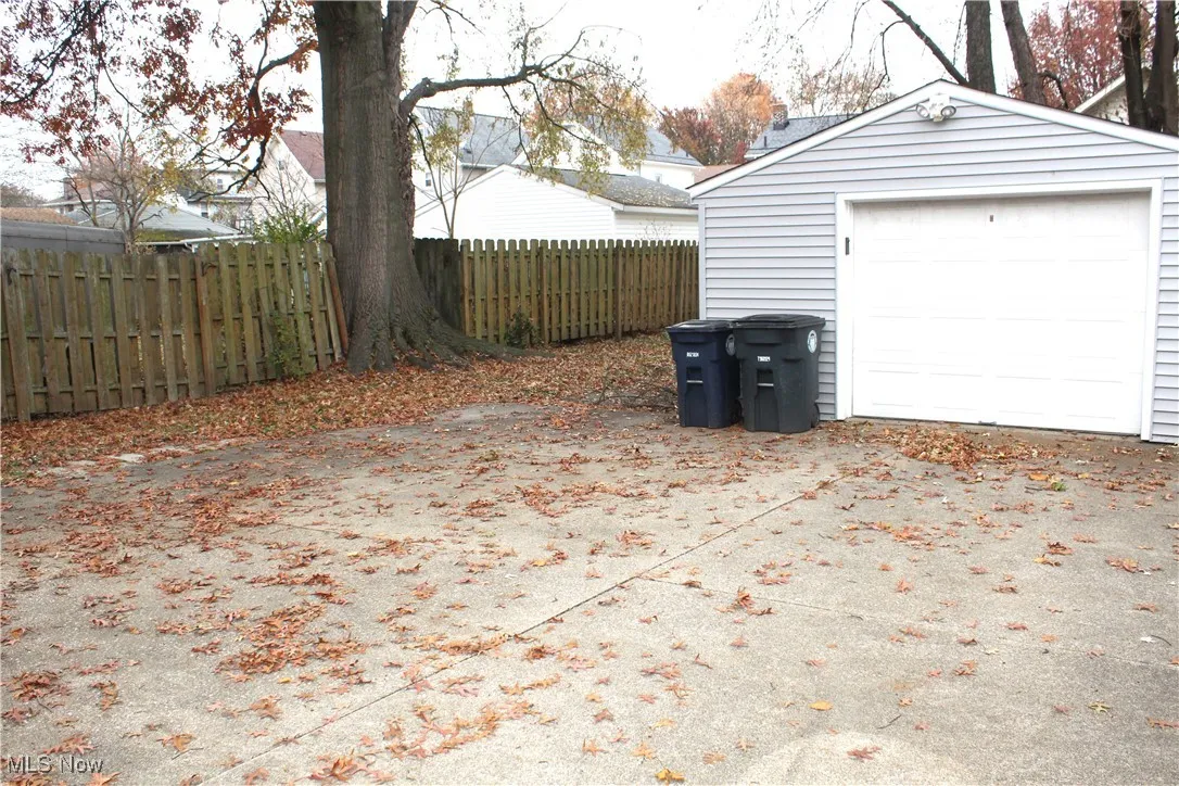 Detached garage featuring driveway
