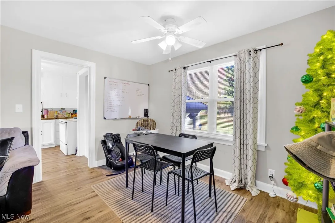 Dining area featuring LVT flooring and ceiling fan