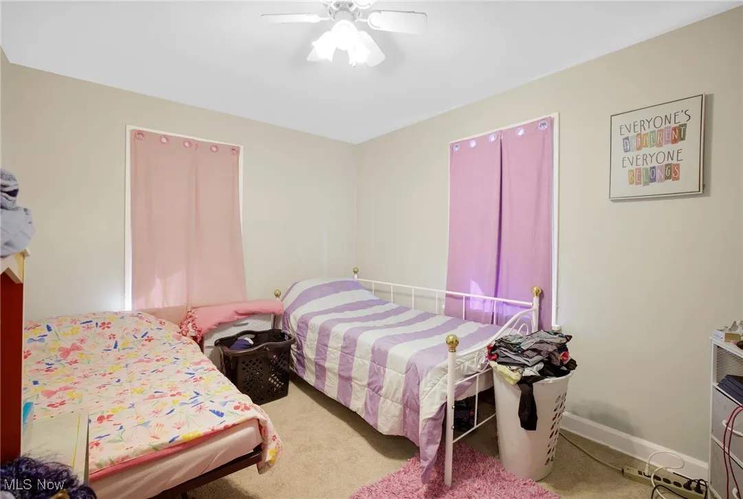 Bedroom featuring carpet and a ceiling fan