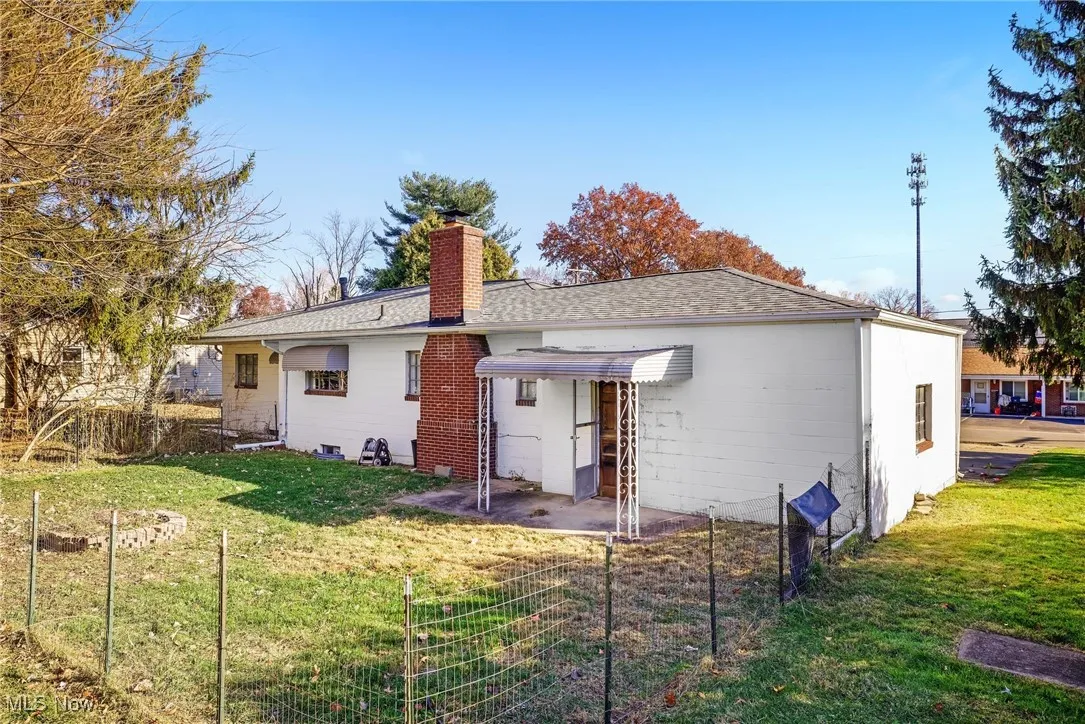 Back of house with a patio