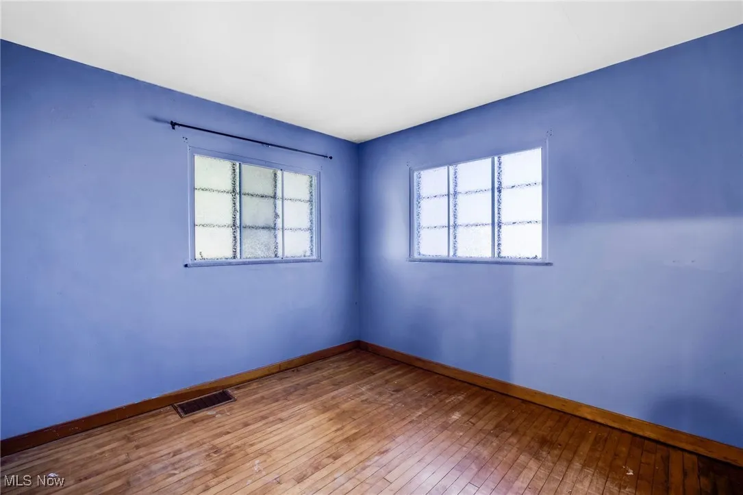 Bedroom featuring hardwood flooring