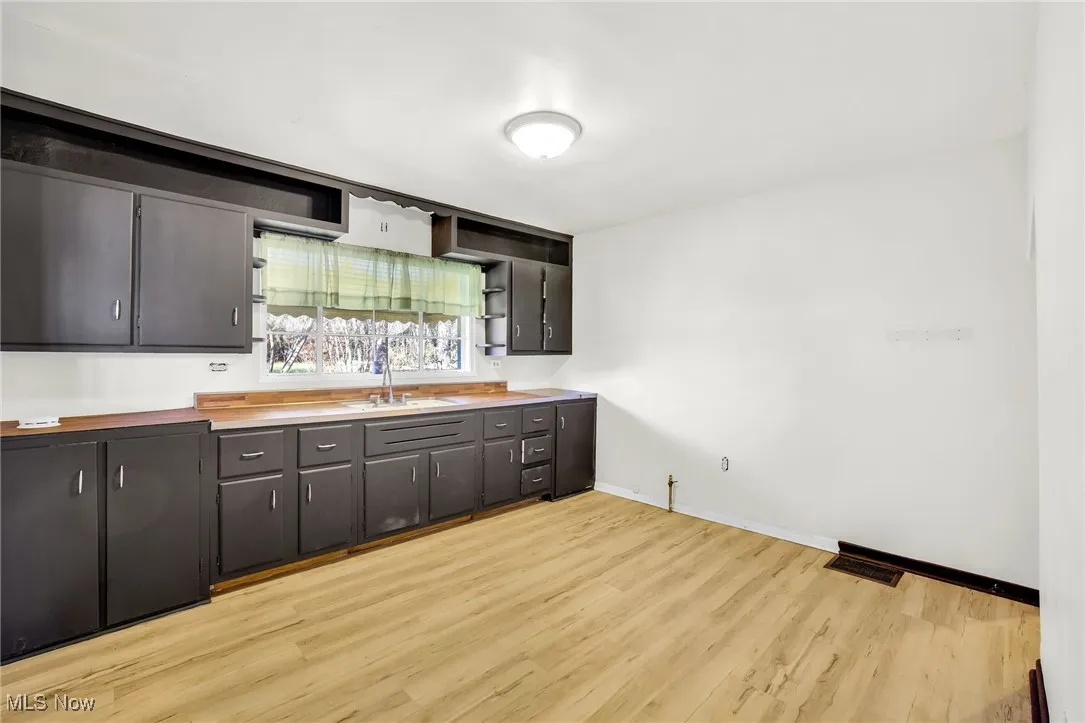 Kitchen with cabinetry and LVT floors
