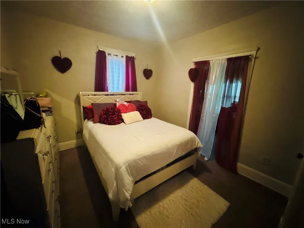 Bedroom featuring baseboards