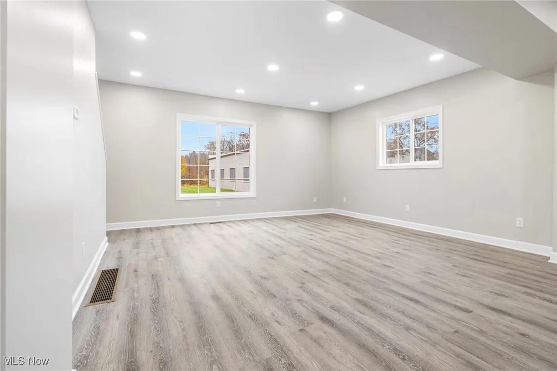 Empty room featuring recessed lighting and light wood-type flooring