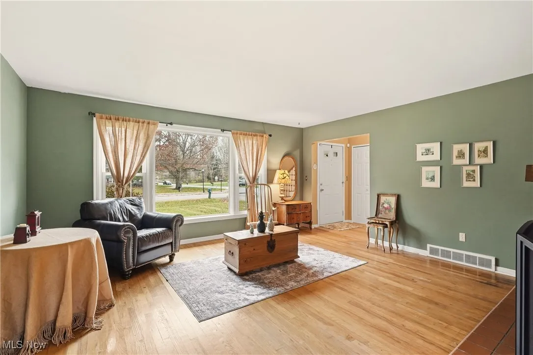 Living area with wood-type flooring and baseboards