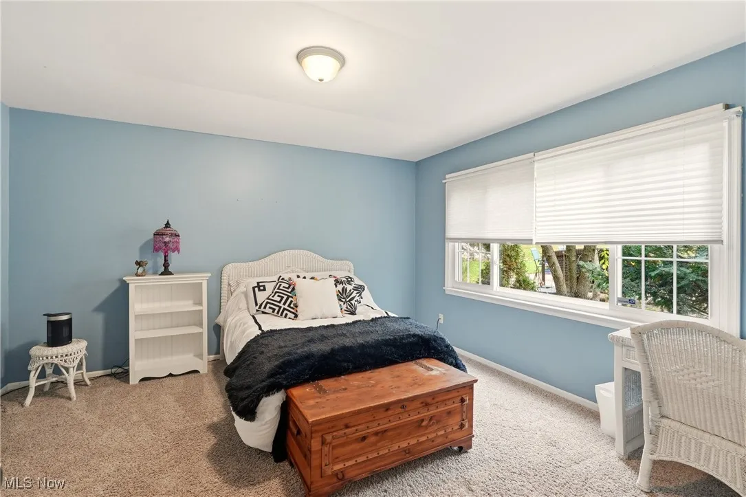 Carpeted bedroom with baseboards
