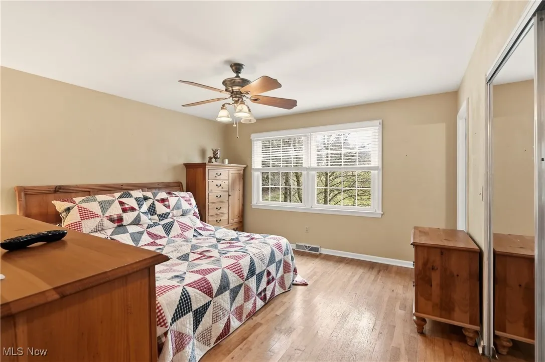 Bedroom featuring light wood finished floors and ceiling fan