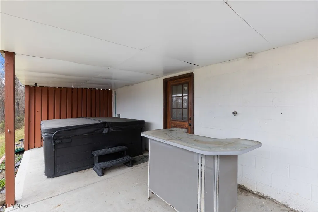 Patio under back deck with Hot Tub