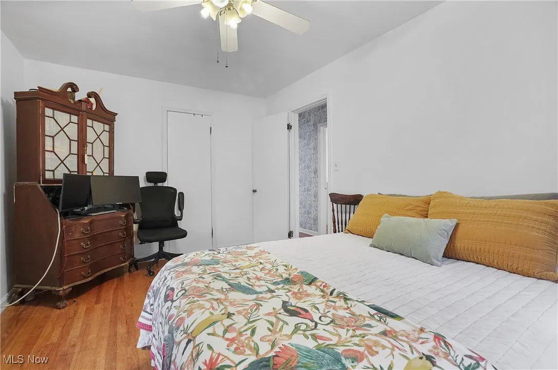Bedroom featuring light wood-style flooring and a ceiling fan