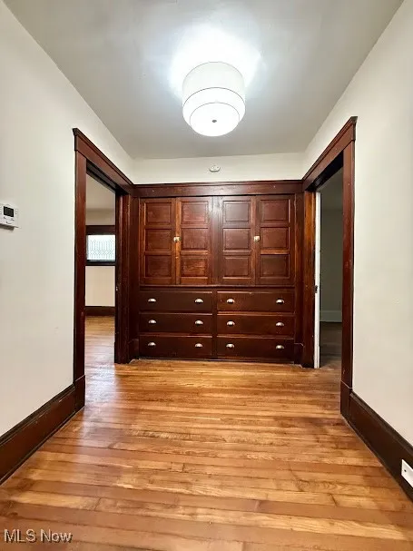 Hallway featuring light wood-type flooring
