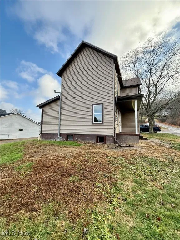 View of home's exterior featuring a yard