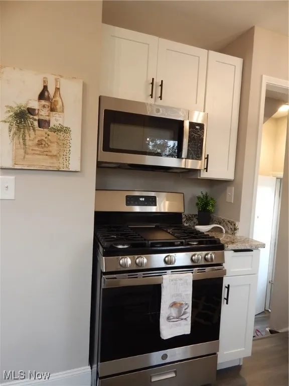 Be the first to Enjoy your all-new Gas, stainless steel stove with griddle & Microwave, white cabinetry, granite counters, and beautiful LVT flooring.