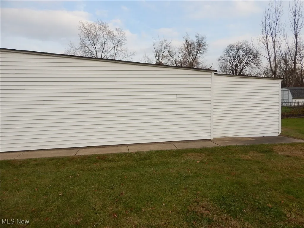 Side view of garage shows the additional workshop area.