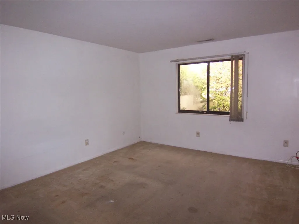 View of carpeted master bedroom on first floor