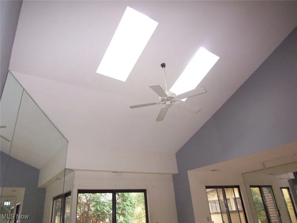 Detailed view of a skylight and ceiling fan