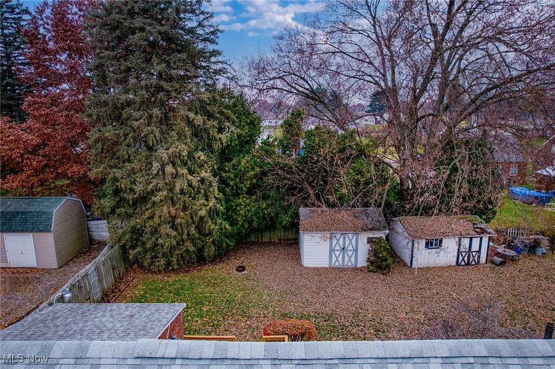View of yard with a storage unit