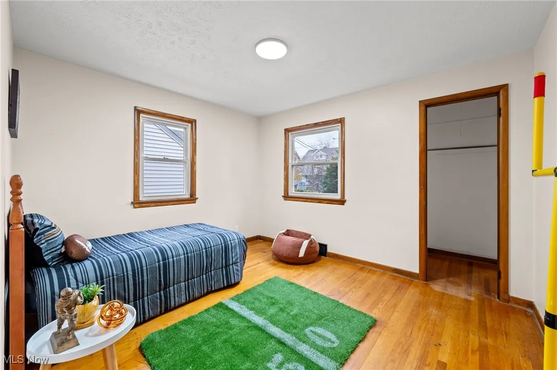 Bedroom featuring light wood-style flooring and a textured ceiling