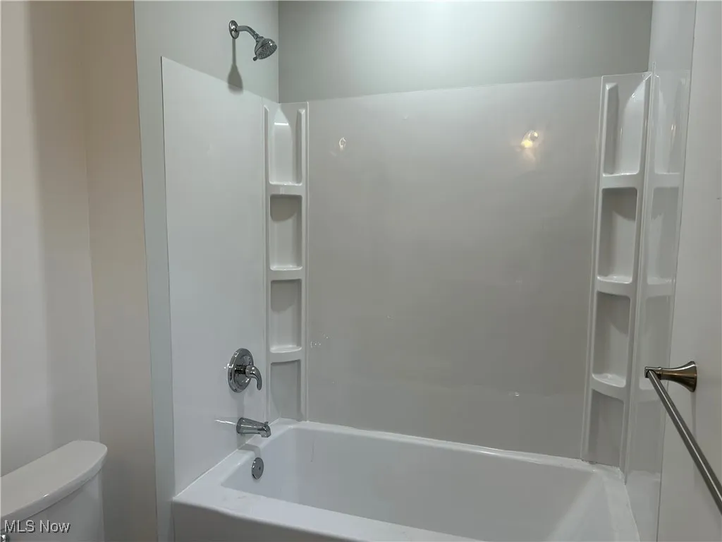 Full bath with tub / shower combination and toilet