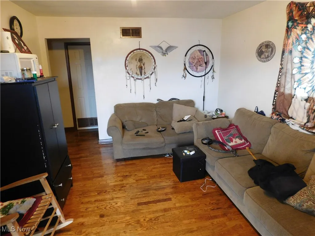 Living area with wood finished floors