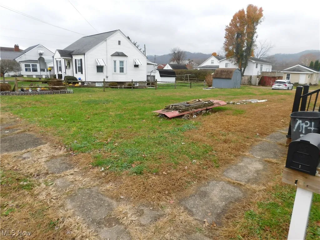 View of yard with a storage shed