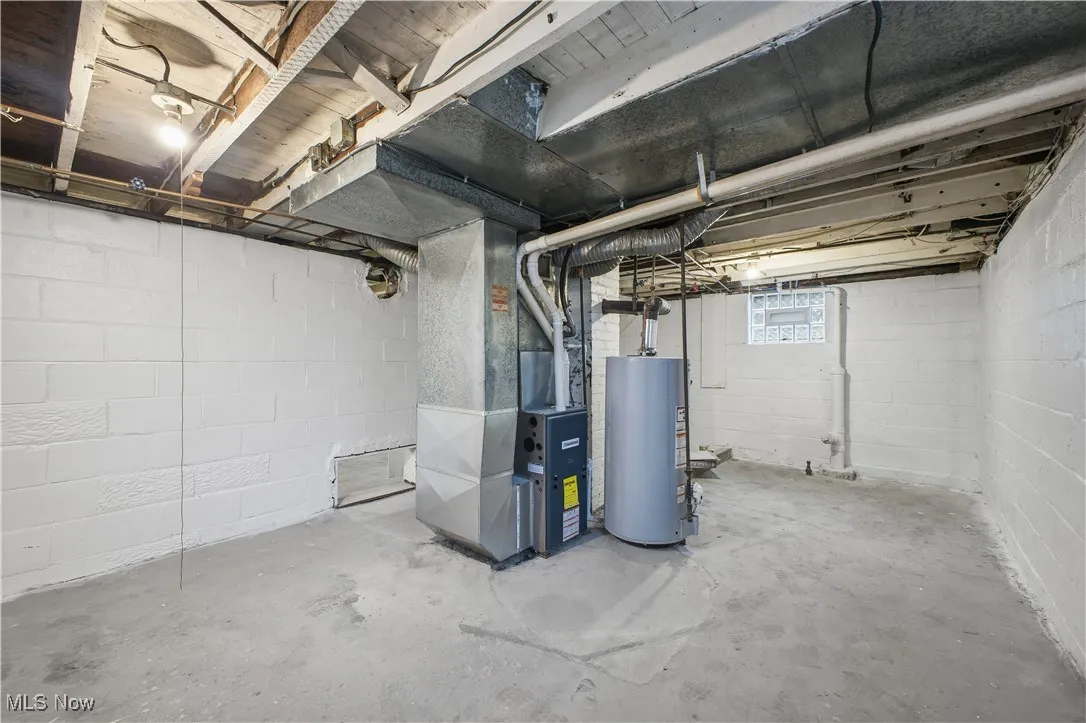 Below grade area with gas water heater and heating unit