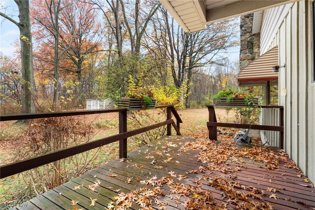 View of wooden side deck and flower boxes