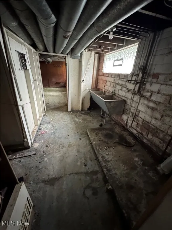 Below grade area with a sink