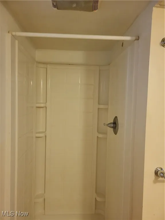 Full bathroom with a stall shower