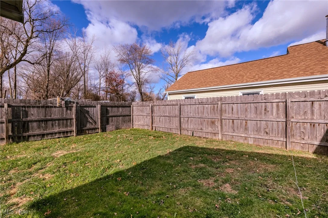Fenced backyard with a gate