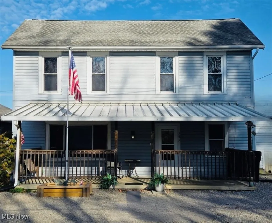 View of front of house with covered porch