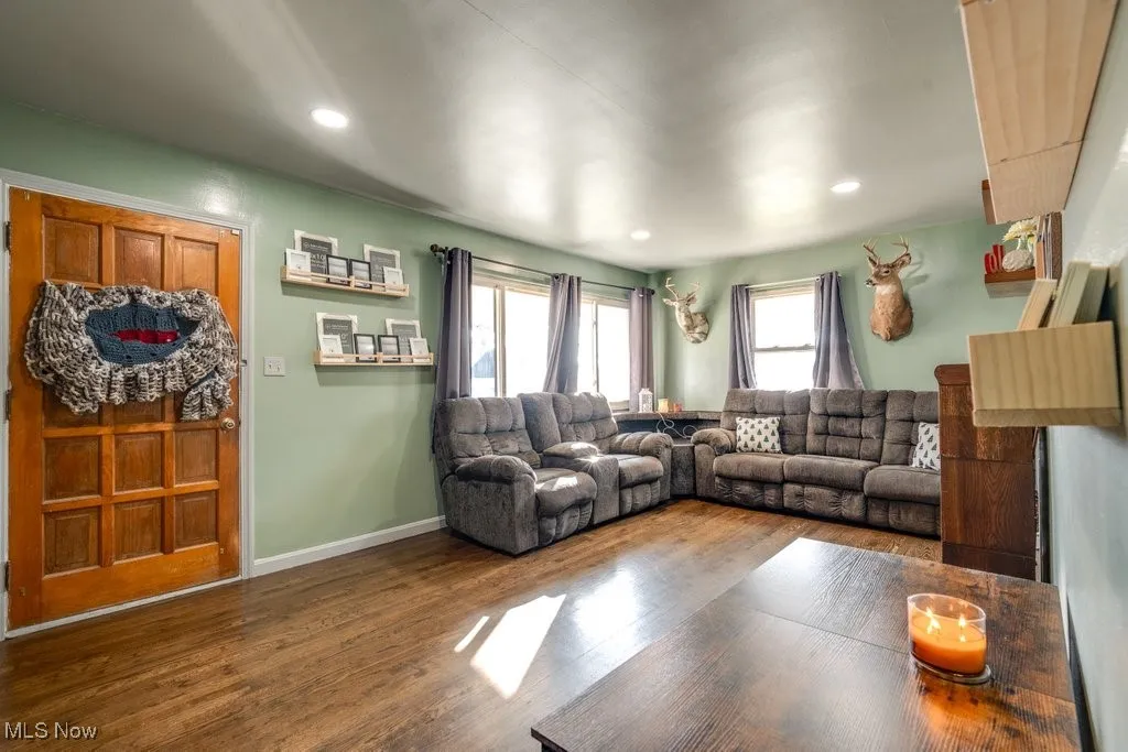 Living area featuring wood finished floors and recessed lighting